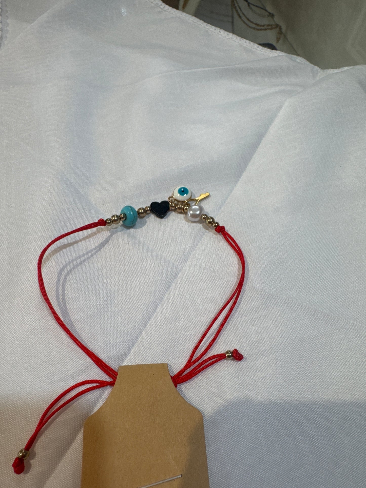 Pulsera Roja Con corazón y llave de apertura